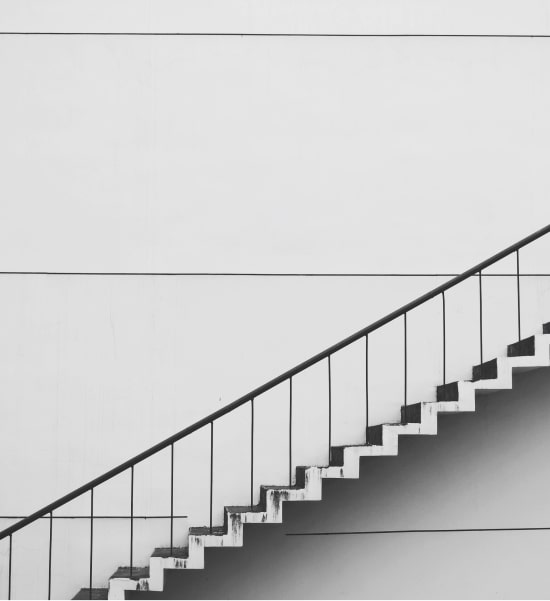 image of a white staircase going up from bottom left to top right